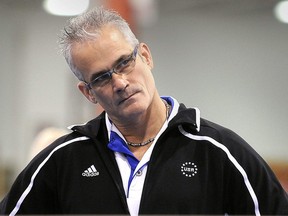 Former U.S. Olympic gymnastics coach John Geddert has died by suicide. He is seen watching his students during practice in Lansing, Michigan, U.S. December 14, 2011.