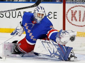New York Rangers goaltender Henrik Lundqvist makes a glove save against the Carolina Hurricanes at Madison Square Garden.