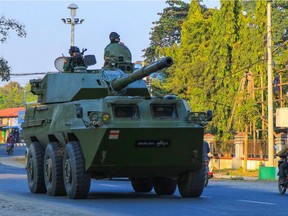 Soldiers in a military armoured vehicle take to the road in Myitkyina, Kachin state on Feb. 3.