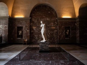 (FILES) In this file photo taken on January 08, 2021 at the Louvre Museum in Paris shows the Venus of Milo sculpture in an empty hall.