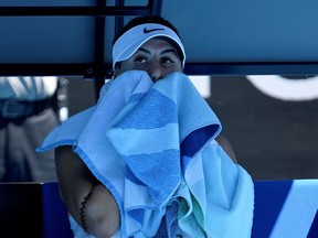 Bianca Andreescu of Canada wipes her face between games during her women's singles match against Taiwan's Su-Wei Hsieh on Day 3 of the Australian Open in Melbourne.