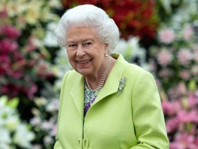 (FILES) In this file photo taken on May 20, 2019 Britain's Queen Elizabeth II visits the 2019 RHS Chelsea Flower Show in London. - Queen Elizabeth II said on Thursday, February 25 that her coronavirus jab "didn't hurt at all" and urged those wary of receiving the vaccine to "think about other people".