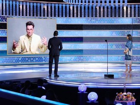 This handout photo courtesy of NBCUniversal shows Dan Levy accepting the Best Musical/Comedy Series award for "Schitt's Creek" via video from Sterling K. Brown and Susan Kelechi Watson at the 78th Annual Golden Globe Awards held at the Beverly Hilton Hotel in Beverly Hills, California, on Sunday.