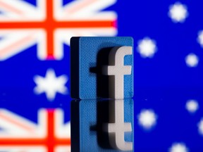 A 3D printed Facebook logo is seen in front of displayed Australia's flag in this illustration photo.