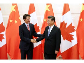 Best buddies? Chinese President Xi Jinping (R) shakes hands with  Prime Minister Justin Trudeau in Beijing in 2016. A lot has changed since then – though perhaps not in Canada's wilfully blind attitude.