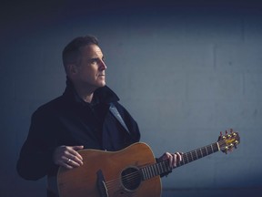 Sean McCann with his guitar.