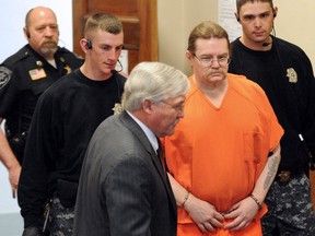 Convicted murderer Ronald Smith, a Canadian, is shown being escorted in for a hearing at Powell County District Court in Deer Lodge, Montana on May 2, 2012.