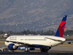 A Delta Boeing 757 jet taxies for takeoff at Salt Lake City International Airport in Salt Lake City, Utah.