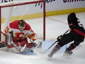 Ottawa Senators right wing Connor Brown tries to recover the puck on a rebound from Calgary Flames goalie Artyom Zagidulin in the third period at the Canadian Tire Centre on Thursday.