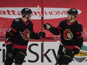 Ottawa Senators right wing Drake Batherson (left) celebrates with left wing Tim Stutzle after scoring a goal against the Calgary Flames in the first period at the Canadian Tire Centre.