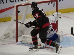 Montreal Canadiens goalie Jake Allen (34) makes a save on a shot from Ottawa Senators right wing Drake Batherson (19) in the third period at the Canadian Tire Centre.