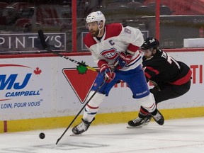 Montreal Canadiens defenceman Shea Weber skates with the puck in front of Ottawa Senators center Chris Tierney in the second period at the Canadian Tire Centre on Sunday.
