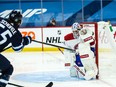 Canadiens goalie Jake Allen makes a save on a shot by Jets forward Mark Scheifele during the second period at Bell MTS Place on Saturday night.