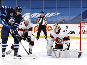 Senators goalie Matt Murray, right, in action during the Feb. 11 game against the Jets. He left that contest after two periods because of a neck strain.