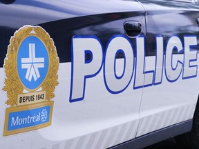 The Montreal Police logo is seen on a police car.