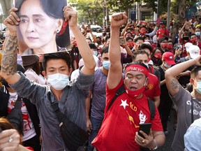 NLD supporters shout slogans outside Myanmar's embassy during a rally after the military seized power from a democratically elected civilian government and arrested its leader Aung San Suu Kyi, in Bangkok, Thailand February 1, 2021.