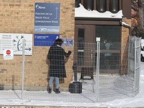 A fenced-in area outside Le Patro d'Ottawa community centre on Monday, Feb. 8, 2021. The centre has been turned into an isolation centre for homeless people.