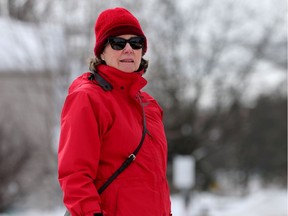 Dianne Breton, a member of the Snow Moles, hits a sidewalk just off Main Street in Ottawa Thursday. The Snow Moles gather feedback on the walkability/accessibility of Ottawa sidewalks in winter.