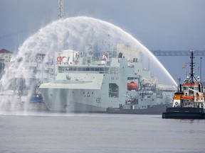 HMCS Harry deWolf heads from the Irving-owned Halifax Shipyard on its way to being delivered to the Royal Canadian Navy dockyard in Halifax on July 31, 2020.