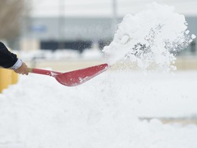 A person shovels snow.