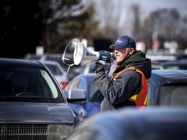 Ottawa city staff were announcing over megaphones, time slots for vaccinations so people could safely and warmly wait in their vehicles till their turn came up.
