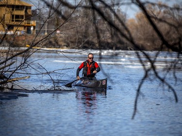 Pierre Lavictoire in his canoe on the Rideau River near Clegg Ave.