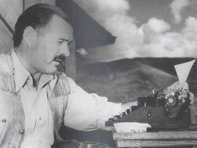 Ernest Hemingway, seen here at his typewriter, said he learned his style as a reporter: "Use short sentences ... vigorous English".