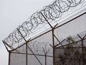 Barbed wire tops the fences at the Ottawa Carleton Detention Centre on Innes Rd.