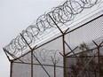 Barbed wire tops the fences at the Ottawa Carleton Detention Centre on Innes Road. Once again, overcrowding plagues the jail.