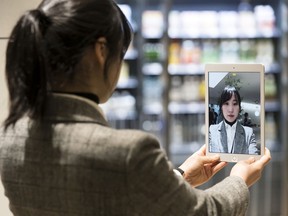 An employee demonstrates one way facial recognition is used: for payment at a NEC SMART STORE at the NEC Corporation headquarters in Tokyo, in this photo from 2020. In Canada, without robust regulation, the software may be misused, notably  by police forces, hurting racialized people the most.