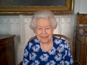 In this handout photo provided by Buckingham Palace, Her Majesty Queen Elizabeth II speaks on a video call to thank volunteers with the Royal Voluntary Service on March 19, 2021 in Windsor, United Kingdom.