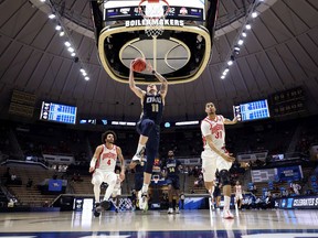 Carlos Jurgens of the Oral Roberts Golden Eagles drives to the basket against the Ohio State Buckeyes in the first round game of the 2021 NCAA men's basketball tournament on Friday in West Lafayette, Ind.