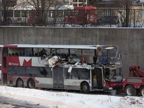 The OC Transpo bus involved in the crash at Westboro Station was towed from the scene, revealing extensive damage, on Jan. 12, 2019.