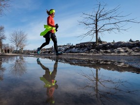 FILE: A woman enjoys a jog on a not-so-cold morning.