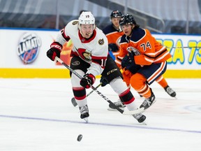 Edmonton Oilers' Ethan Bear chases Ottawa Senators' Ryan Dzingel during second period NHL action at Rogers Place in Edmonton, on Monday, March 8, 2021.