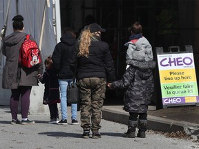 File: Parents taking their children to be tested for Covid-19 at the testing centre at Brewer Arena in Ottawa