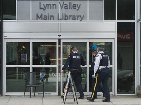 North Vancouver RCMP and B.C. Ambulance Service at the scene of a multiple stabbing at the Lynn Valley branch of the North Vancouver Public Library on Saturday, March 27.