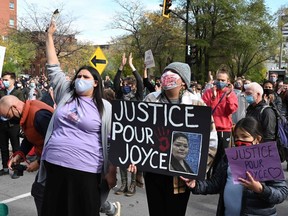 Protesters gather during a demonstration in Montreal on Oct. 3 to demand action for the death of Joyce Echaquan, who was subjected to live-streamed racist slurs by hospital staff before her death.