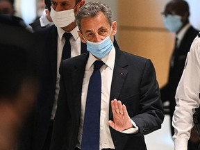 Former French president Nicolas Sarkozy arrives at the Paris court house to hear the final verdict in a corruption trial on March 1, 2021.