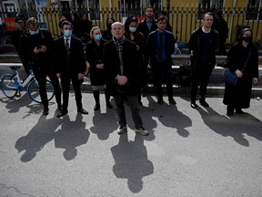 Diplomats from various countries including Jim Nickel (C), deputy head of mission of the Canadian embassy in Beijing, wait outside of the Dandong Intermediate People's Court, where the trial of Canadian businessman Michael Spavor under spying charges is being held, in Dandong in China's northeast.
