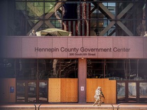 Minnesota National Guards patrol outside the Hennepin County Government Center during the opening statement of former Minneapolis Police officer Derek Chauvin on March 29, 2021 in Minneapolis, Minnesota.