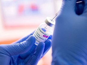 A nurse fills a syringe with AstraZeneca's vaccine against Covid-19