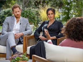 FILE PHOTO: Britain's Prince Harry and Meghan, Duchess of Sussex, are interviewed by Oprah Winfrey in this undated handout photo.