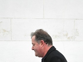 Journalist and television presenter Piers Morgan walks near his house, after he left his high-profile breakfast slot with the broadcaster ITV, following his long-running criticism of Prince Harry's wife Meghan, in London, Britain, March 10, 2021.