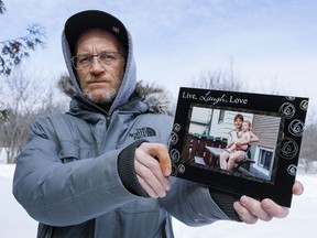 Aaron Gruntke displays a photo of himself when he was four years old with his mother Linda. Linda Gruntke died at the age of 59 while in a for-profit long-term care facility.
