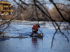 Pierre Lavictoire launched his canoe and went for a paddle in the Rideau River near Clegg Street on the first weekend of spring, Sunday, March 21, 2021.