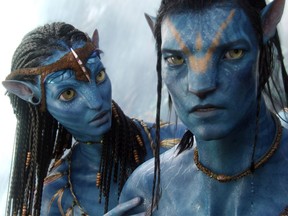 Neytiri (Zoe Saldana) and Jake (Sam Worthington) make final preparations for an epic battle that will decide the fate of an entire world in a scene from Avatar.