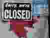 A file photo of a "closed" sign in a store window in Ottawa in April 2020.