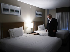Files:  Ontario Premier Doug Ford visits the Holiday Inn Express and Suites, which is used as a COVID-19 isolation hotel during the COVID-19 pandemic in Oshawa, Ont., in January, 2021