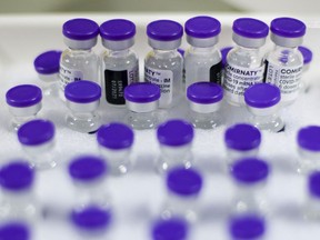 Files: Vials of COVID-19 vaccine, produced by Pfizer Inc. and BioNTech SE, in cold storage.